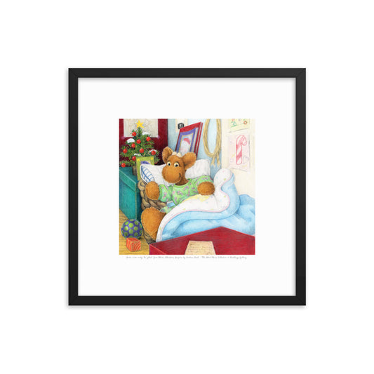 Elliot Moose a children's book character, is jumping out of his basket bed to look at a big red box at the end of his bed. A Christmas tree is in the back ground. From the Book Elliot's Christmas Surprise by Andrea Beck