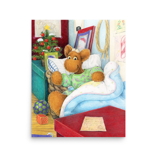 Elliot Moose a children's book character, is jumping out of his basket bed to look at a big red box at the end of his bed. A Christmas tree is in the back ground. From the Book Elliot's Christmas Surprise by Andrea Beck