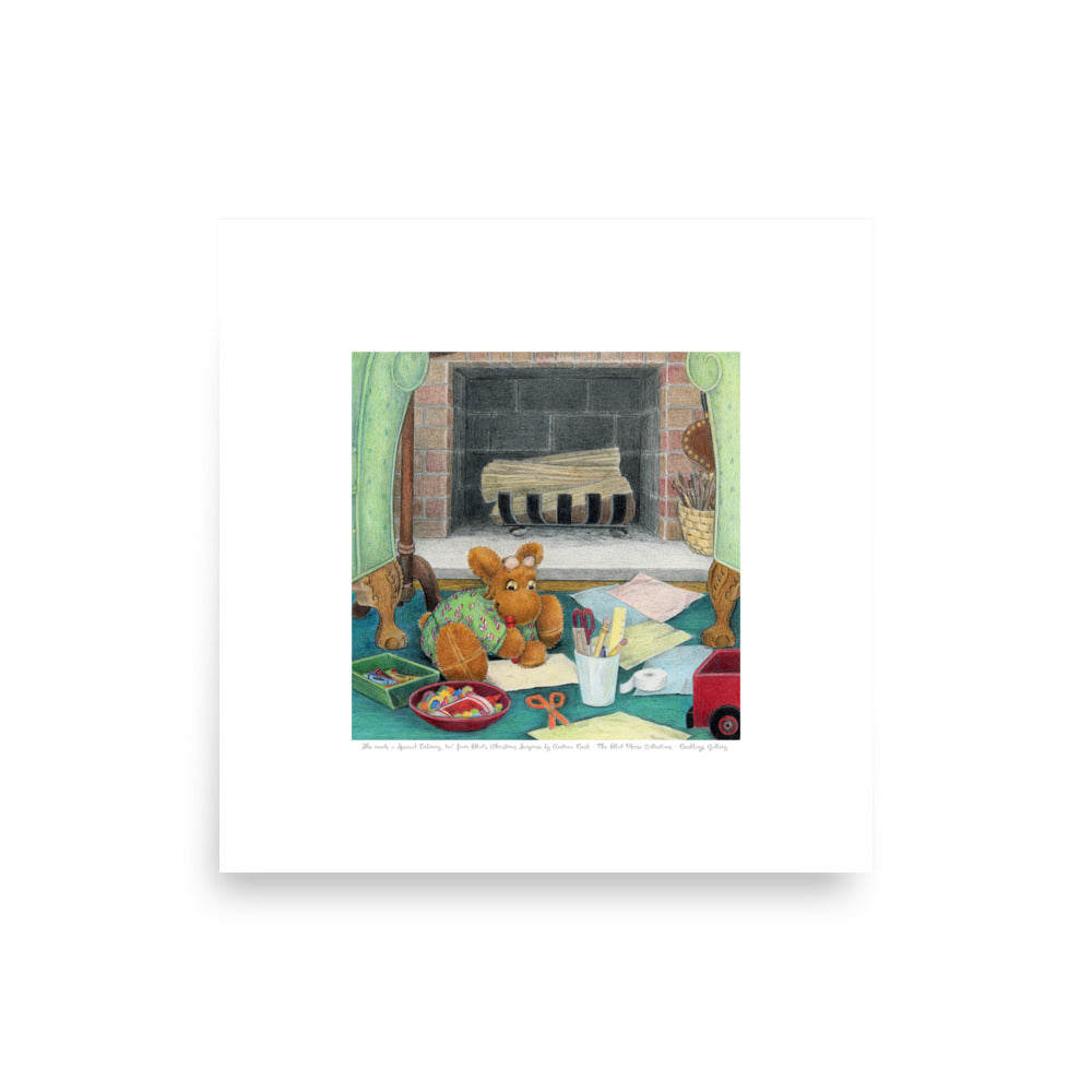 Delightful literary Christmas art for a child's room. Picture book character Elliot Moose, a sweet stuffed toy, is making a present for his friend in front of a fireplace. Based on the book Elliot's Christmas Surprise, by Andrea Beck