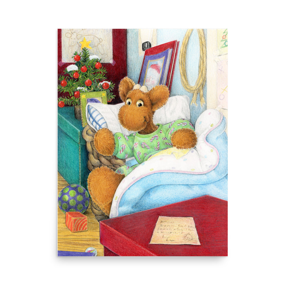 Elliot Moose a children's book character, is jumping out of his basket bed to look at a big red box at the end of his bed. A Christmas tree is in the back ground. From the Book Elliot's Christmas Surprise by Andrea Beck